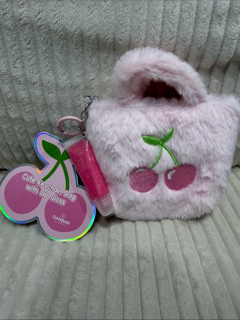 Pink Fuzzy Cherry Keychain Bag with Lip Gloss. New. Not used. So cute!